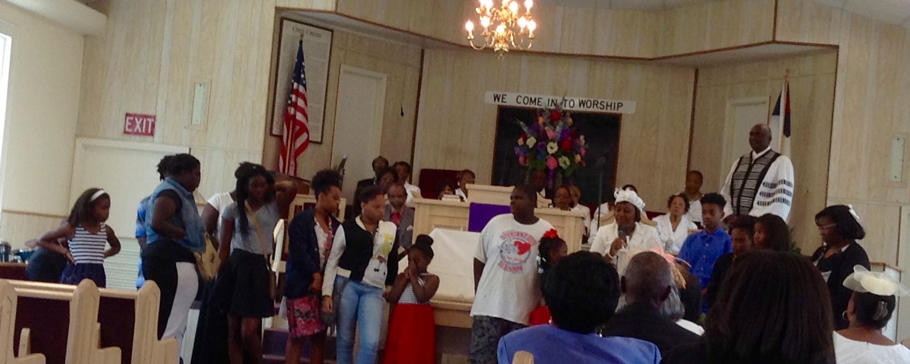 Youth giving praise report after bus trip to Six Flags, September 2015